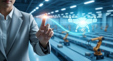 A businesswoman interacts with a holographic display in a futuristic automated factory environment showcasing innovation