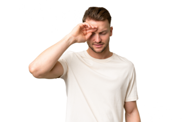 Young blonde caucasian man over isolated background with tired and sick expression