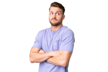 Young handsome caucasian man over isolated chroma key background making doubts gesture while lifting the shoulders