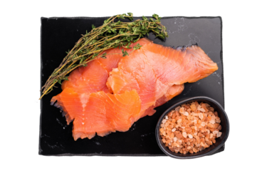 Salty salmon, trout fillet slices with herbs isolated on white background. top view