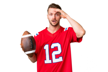 Young caucasian man playing rugby over isolated chroma key background with surprise expression