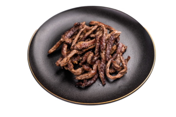 BBQ Fried beef tender strips, sliced steak in a plate isolated on white background