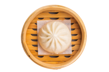 Chinese Bao or Baozi bun with meat in bamboo steamer isolated on white background. top view