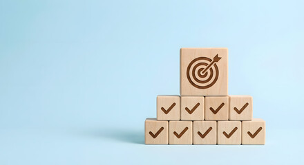wooden blocks with checkmarks and target symbol on blue background