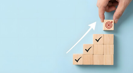business growth concept with hand placing target block on steps