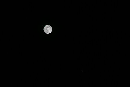 Bright full moon shining in clear night sky with minimal composition, Germany, Wolfegg, 3 January 2026