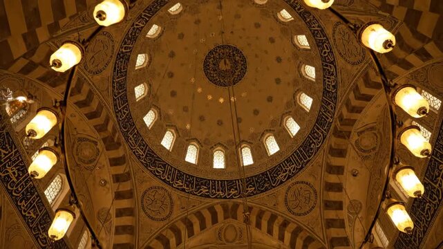 Majestic Mosque Interior: Exploring the Ornate Golden Dome, Intricate Calligraphy, and Grand Chandelier