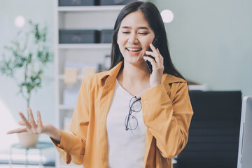 Business woman using calculator for do math finance on wooden desk in office and business working background, tax, accounting, statistics and analytic research concept.
