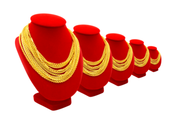 Gold necklace hung on a red stand, alongside gold bars perspective isolated on white background.