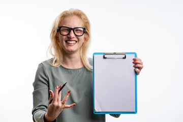 Young businesswoman smiling and showing clipboard with copy space for advertising