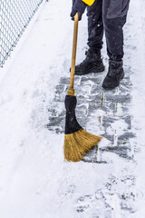 Removing snow from the pathway and street, winter cleaning