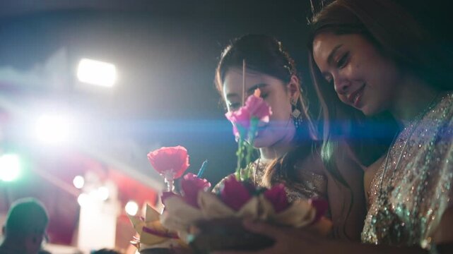 Asian women celebrating loi krathong festival in thailand