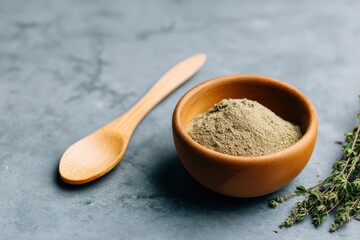Skincare Exfoliation Ritual concept. Bowl of spices with a wooden spoon on a stone surface.