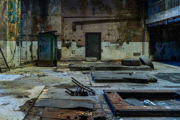 Wide abandoned industrial hall with platforms