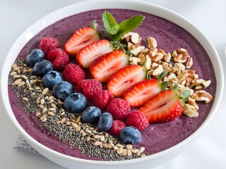 Smoothie bowls topped with a variety of fruits, nuts, and seeds for a healthy breakfast
