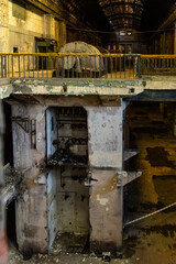 Abandoned power plant interior with generator
