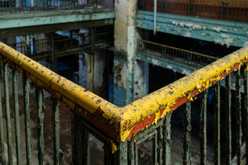 Abandoned industrial balcony with railings