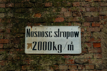 Old industrial load capacity sign