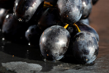 Fresh appetizing ripe red grapes in a detailed macro shot showing skin texture and natural bloom
