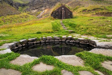 the picturesque Gudrunarlaug thermal bath in Iceland near Saelingsdalur