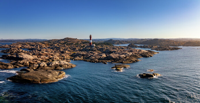 drone panorama view of the Eigeroy Lighthouse on the small island of Midbrodoya near Eigersund in southern Norway