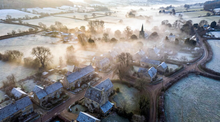 Aerial View of Rural Village Covered in Winter Morning Fog