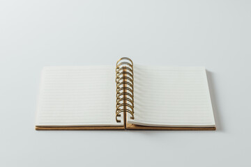 Blank Spiral Notebook Open on a White Surface for Creative Ideas