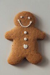 Happy Gingerbread Man Cookie with Icing Decoration on Light Background
