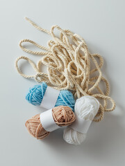 Colorful Yarn Balls and Twine on Light Background for Crafts