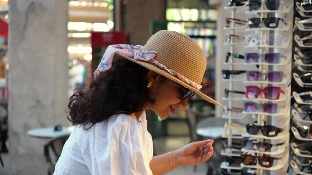 woman buying souvenirs and handmade gifts from travel destinations in India, travel and shopping stock video