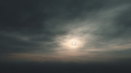 High altitude view of dark altostratus clouds and sun disk above a dense cloud layer
