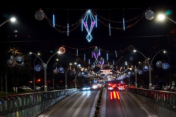 Christmas outdoor sparkling and colorful lights decorations above Dimitrie Cantemir boulevard in Bucharest at night in 2025
