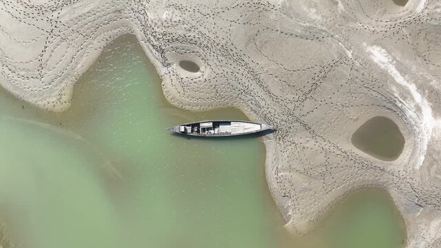 Huge sandbars arise in river Jamuna when the water level drops during the dry season. The striking pattern and textures look like desert when seen from above. Aerial sandbar view