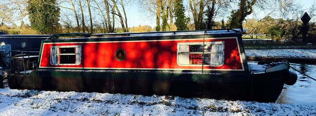 uk canal in winter with snow and frost
