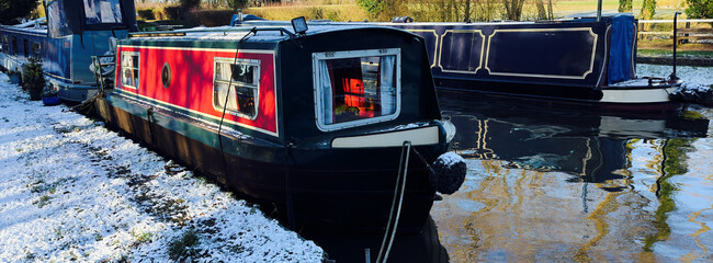 uk canal in winter with snow and frost