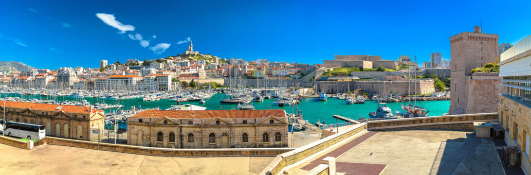 City of Marseille harbor and Notre Dame de la Garde church on the hill panoramic view
