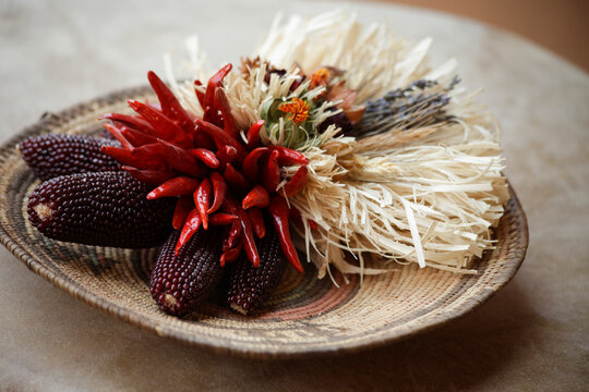 Ojo Caliente, New Mexico, United States. Dried red corn and chili decor 