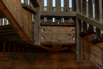 A structural element of the observation tower with a sturdy wooden frame and fasteners.