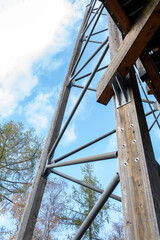Bottom view of wooden supports with metal diagonal links of the structure.