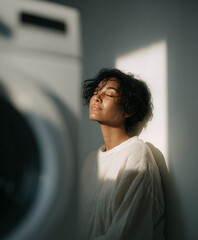Serene Moment: Woman Practicing Mindfulness and Deep Breathing in a Sunlit Minimalist Room