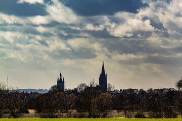 Skyline of Ypres, Belgium under dramatic cloudy sky, historic city of the World War One Western Front and symbol of remembrance.