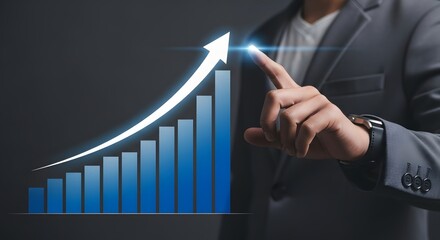 A person in a suit touching a rising blue bar graph with an upward pointing white arrow above