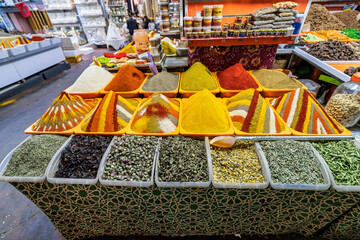 Vibrant Spice Market Display With Colorful Powders And Dried Goods At A Bazaar Stall, Agadir, Morocco