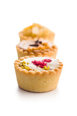 Sweet mini tartlets isolated on white background.