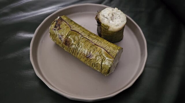 white chocolate cakeIndonesian called Lemang or Lamang is Minang kabau ,West Sumatra traditional food,made from glutinous rice,coconut milk ,costed with banana leaves,cooked in hollowed bamboo tube