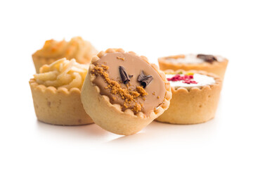 Sweet mini tartlets isolated on white background.