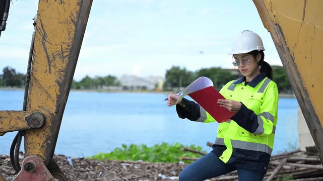 Environmental engineers work at the water storage plant, check the pH of the water, check the quality of the water.