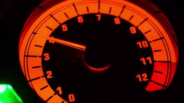 Glowing Red Speedometer Close-Up