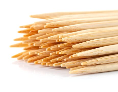 A close-up view of a bundled pile of wooden toothpicks