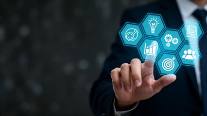 Businessman interacting with digital icons